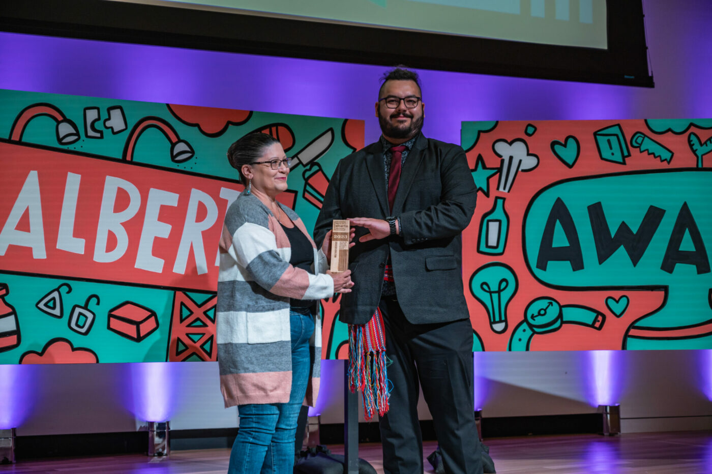 Staci D Wolfe of WolfDen Designz, winner of the Amy Willier Award for Indigenous Artisans, with Jason Chernow. Photograph by Chris Landry.
