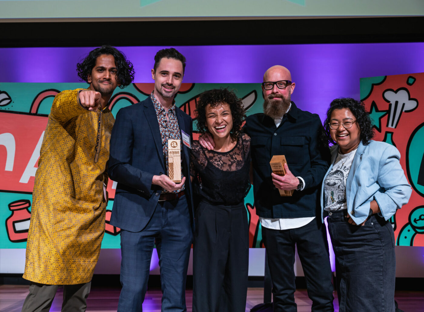 The teams from Vresh Foods and Monster Sauce, co-winners of the savoury food category, with Chanry Thach. Photo by Chris Landry.