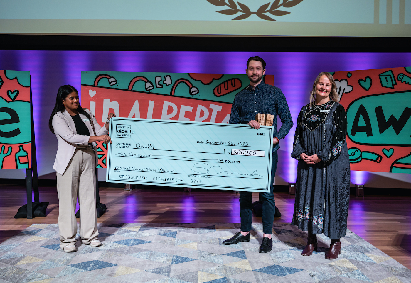 One21's Theo Popilchak (middle), the 2023 fashion and accessories winner and overall winner, with Avenue editors Tsering Asha (left) and Shelley Arnusch (right). Photo by Chris Landry.