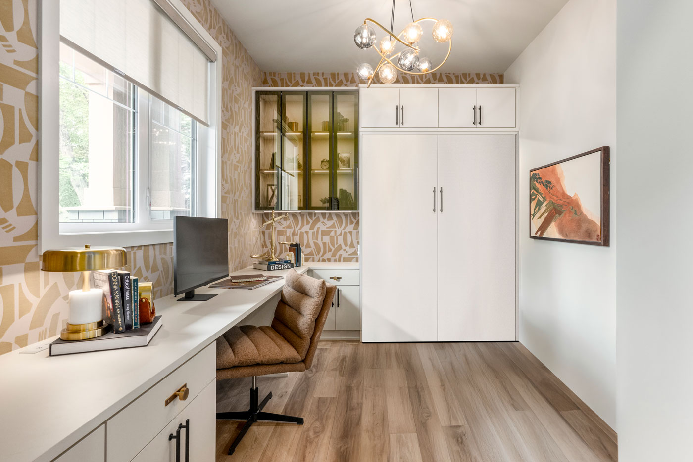 A home office with a murphy bed and desk