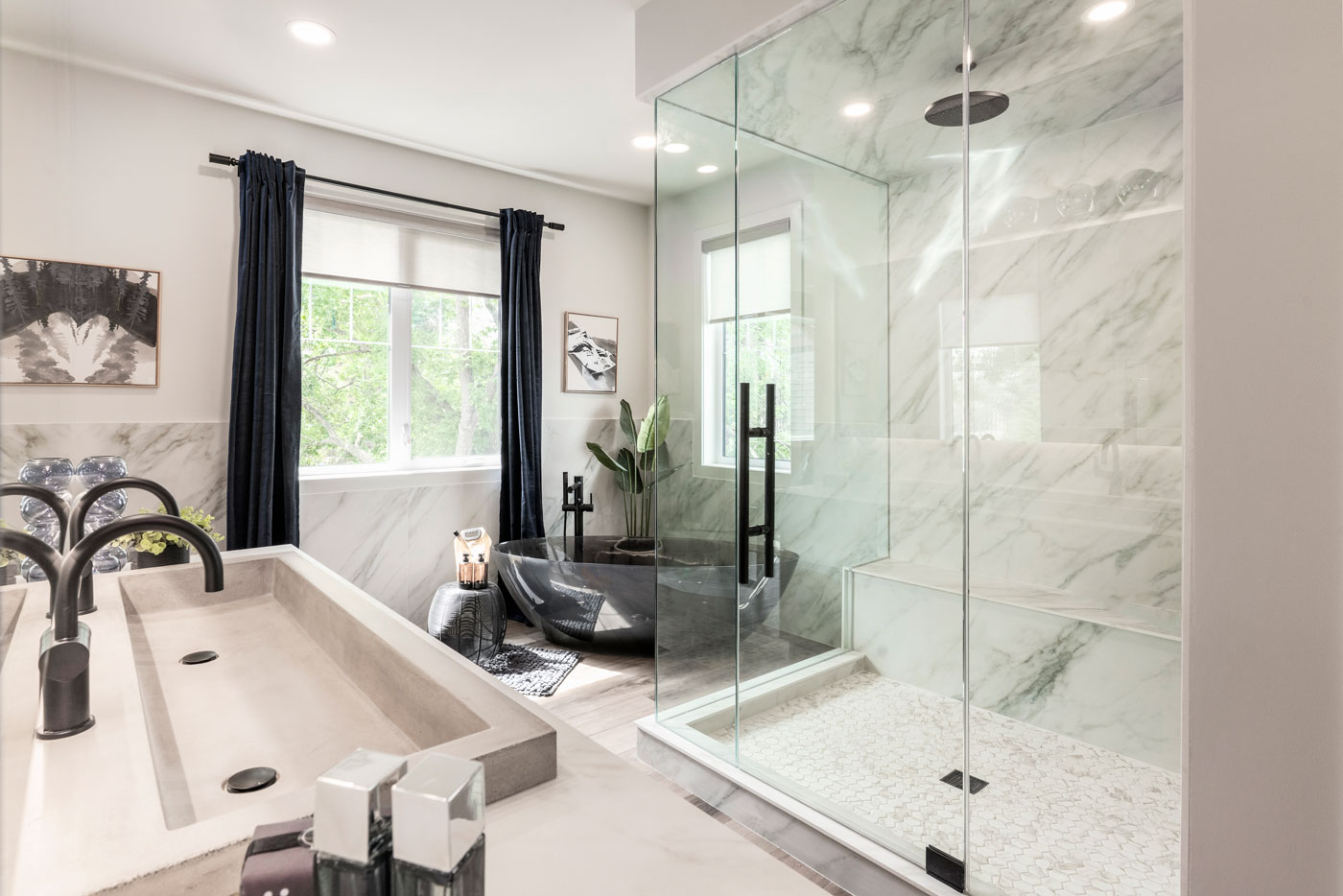 A bathroom with a shower, sink and tub