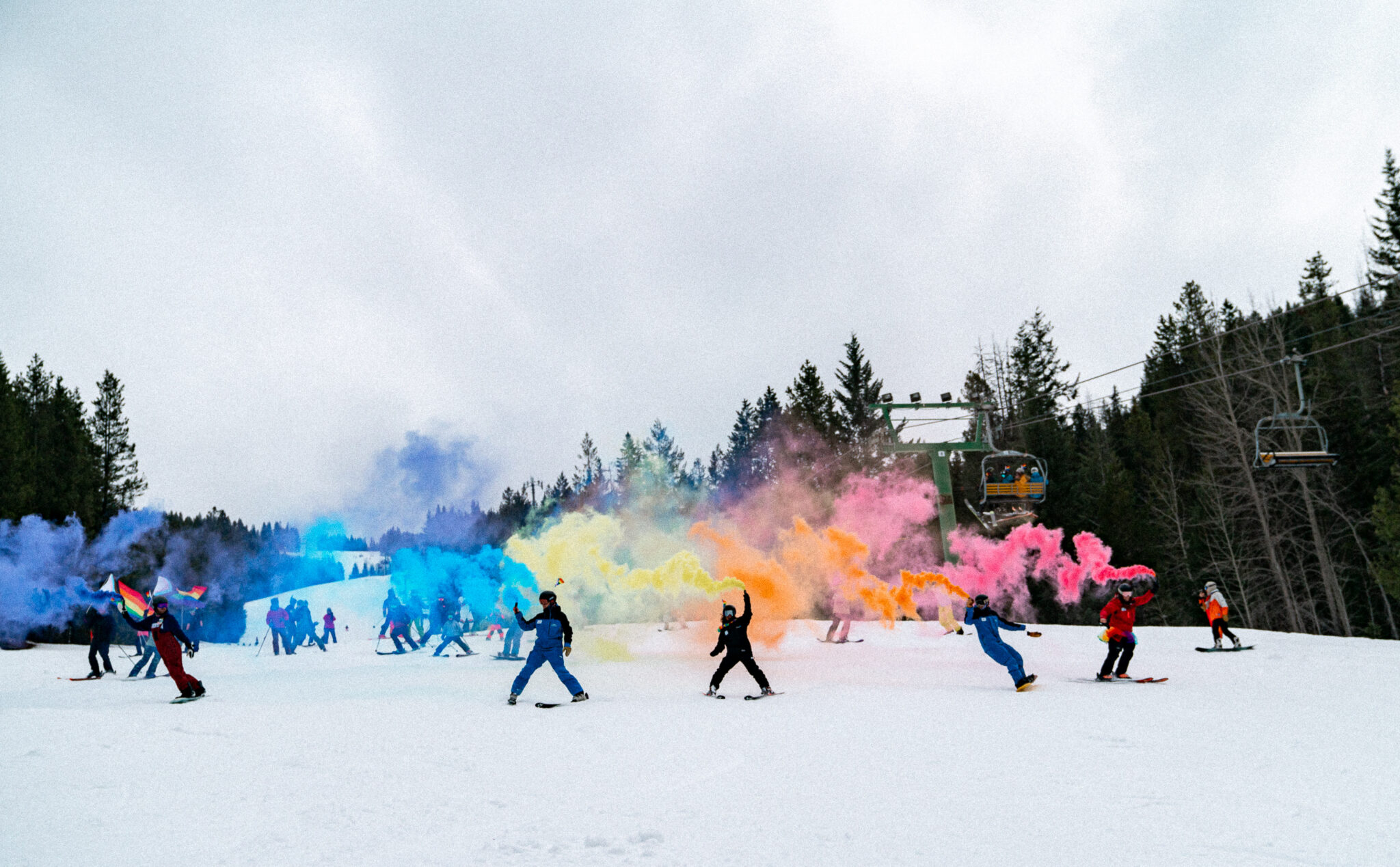 Skiers with coloured smoke at the Panorama Pride in 2024. 