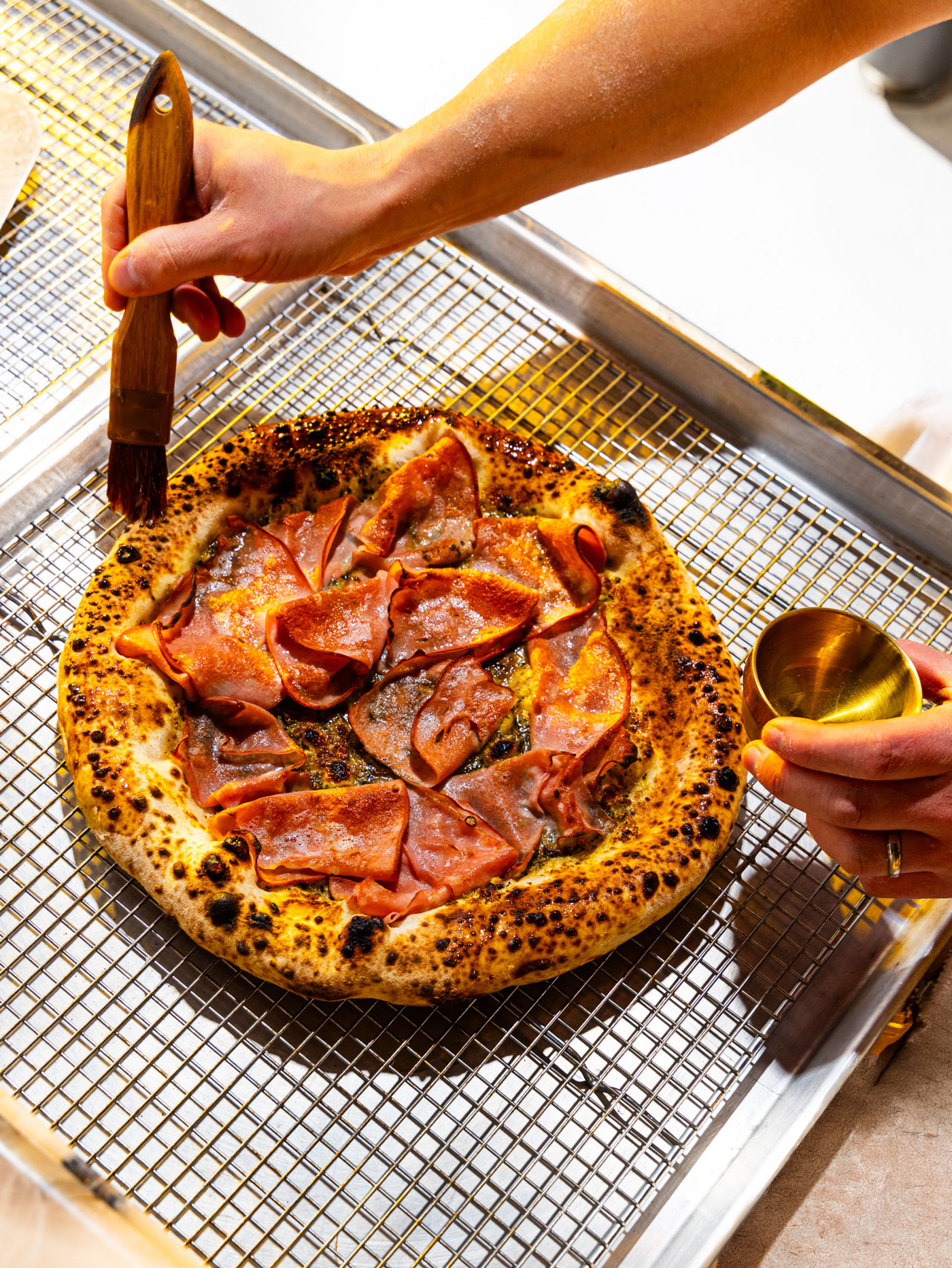 Letty’s mortadella pizza with pistachio pesto.