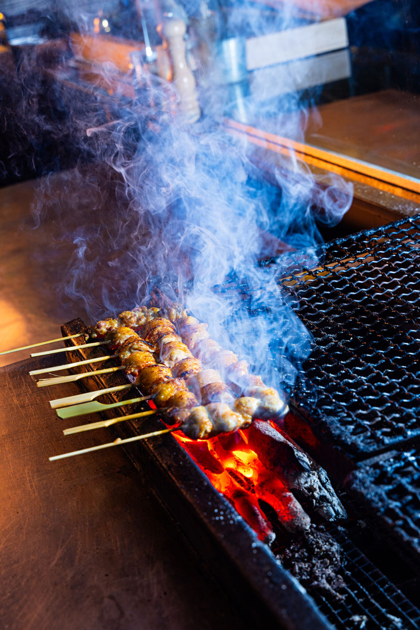 Yakitori cooks over binchotan charcoal, imported straight from Japan.