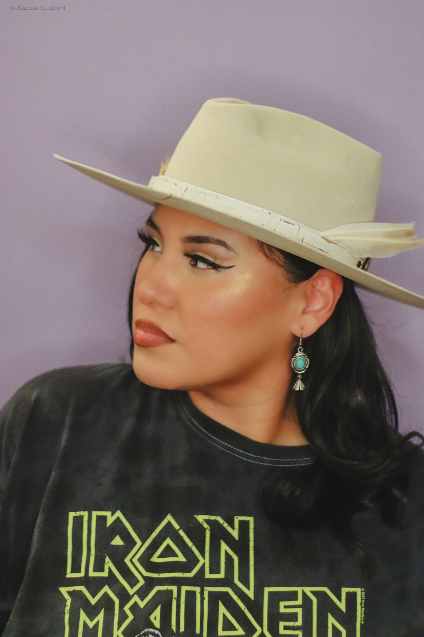 A woman wearing a tall hat.