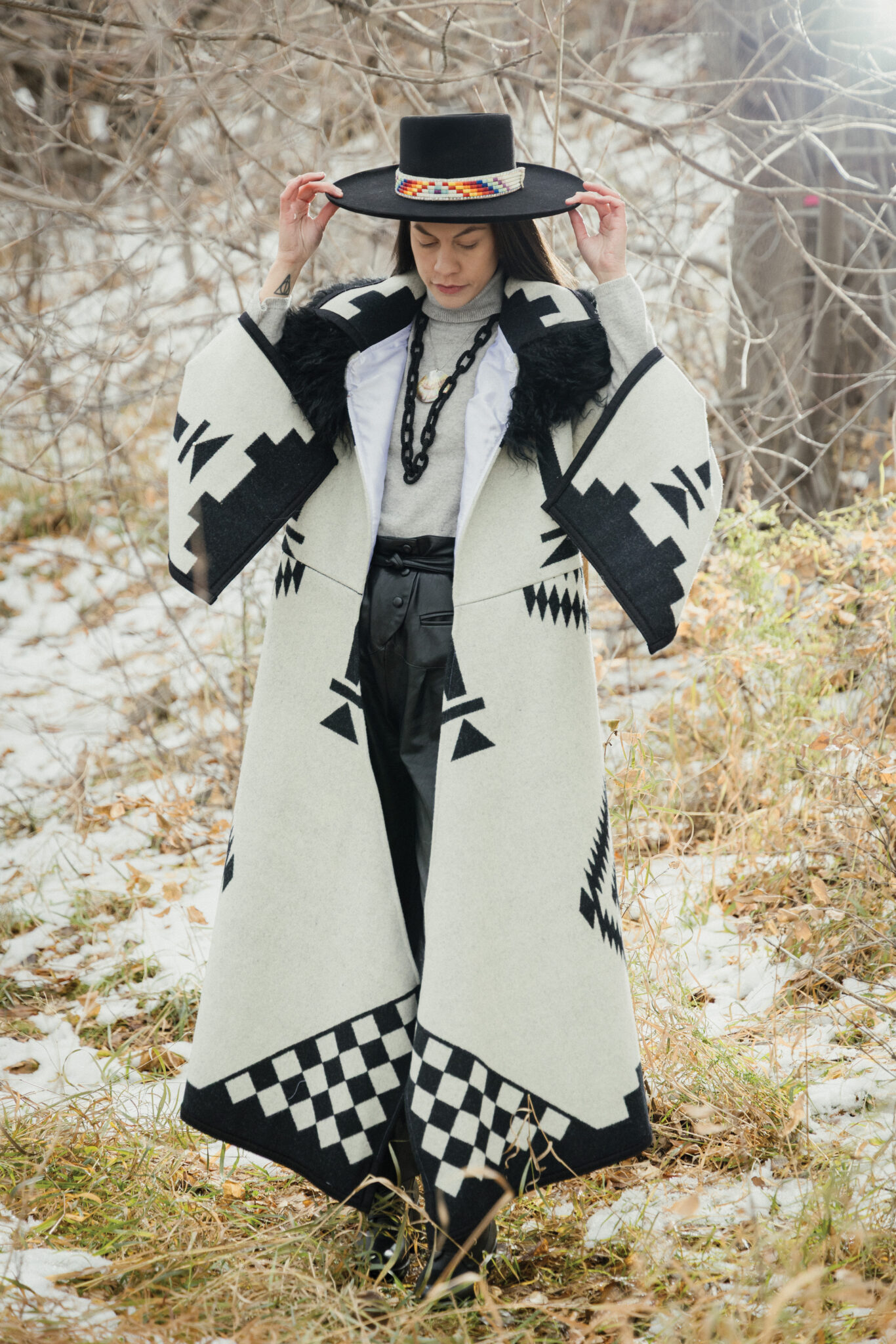 Stephanie Eagletail wearing a black and white Pendleton coat.