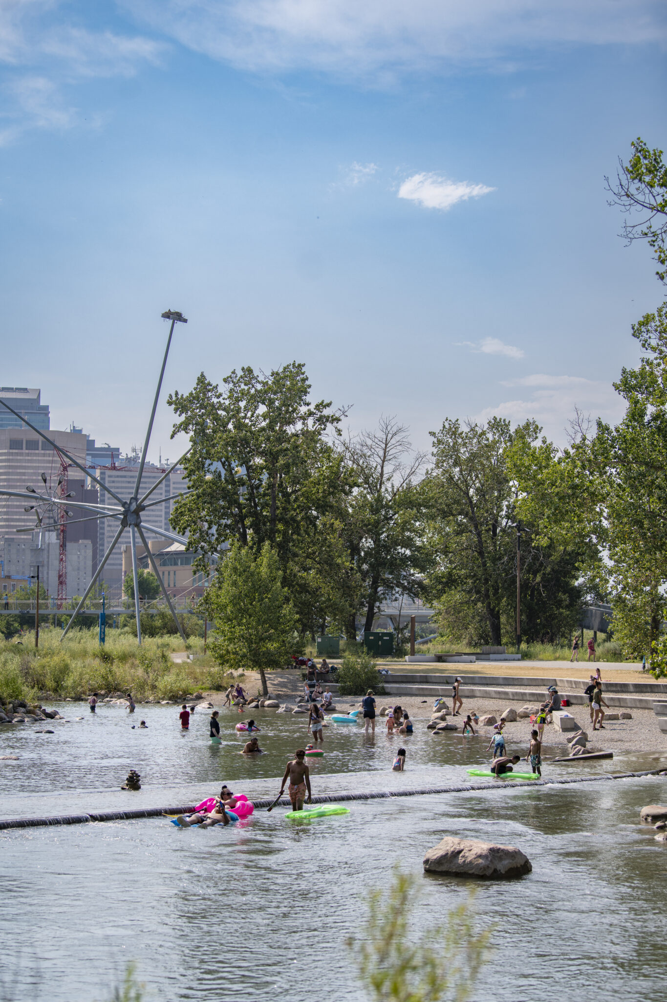 People swimming and floating in the water on St. Patrick's Island.