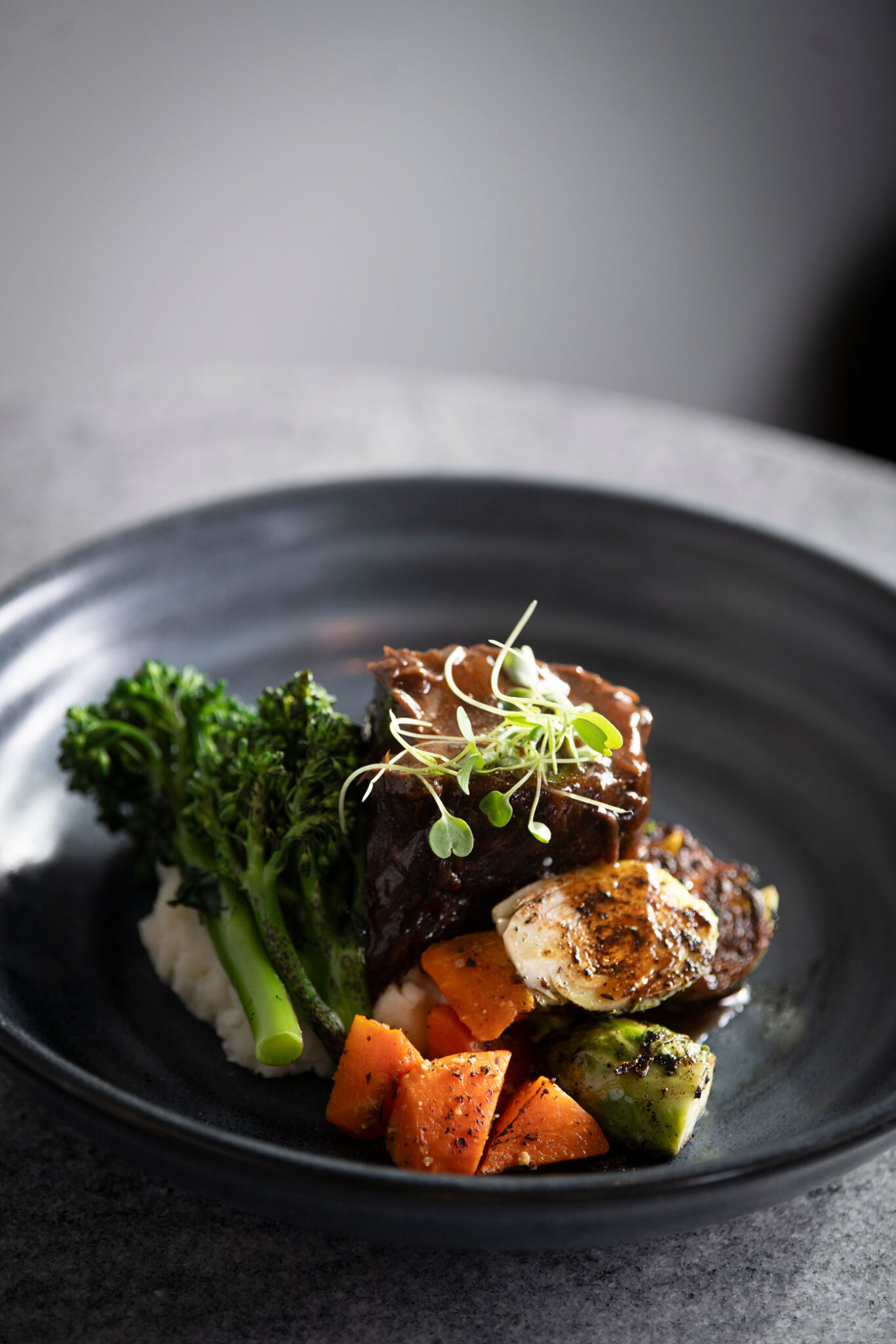 A restaurant dish with meat and vegetables