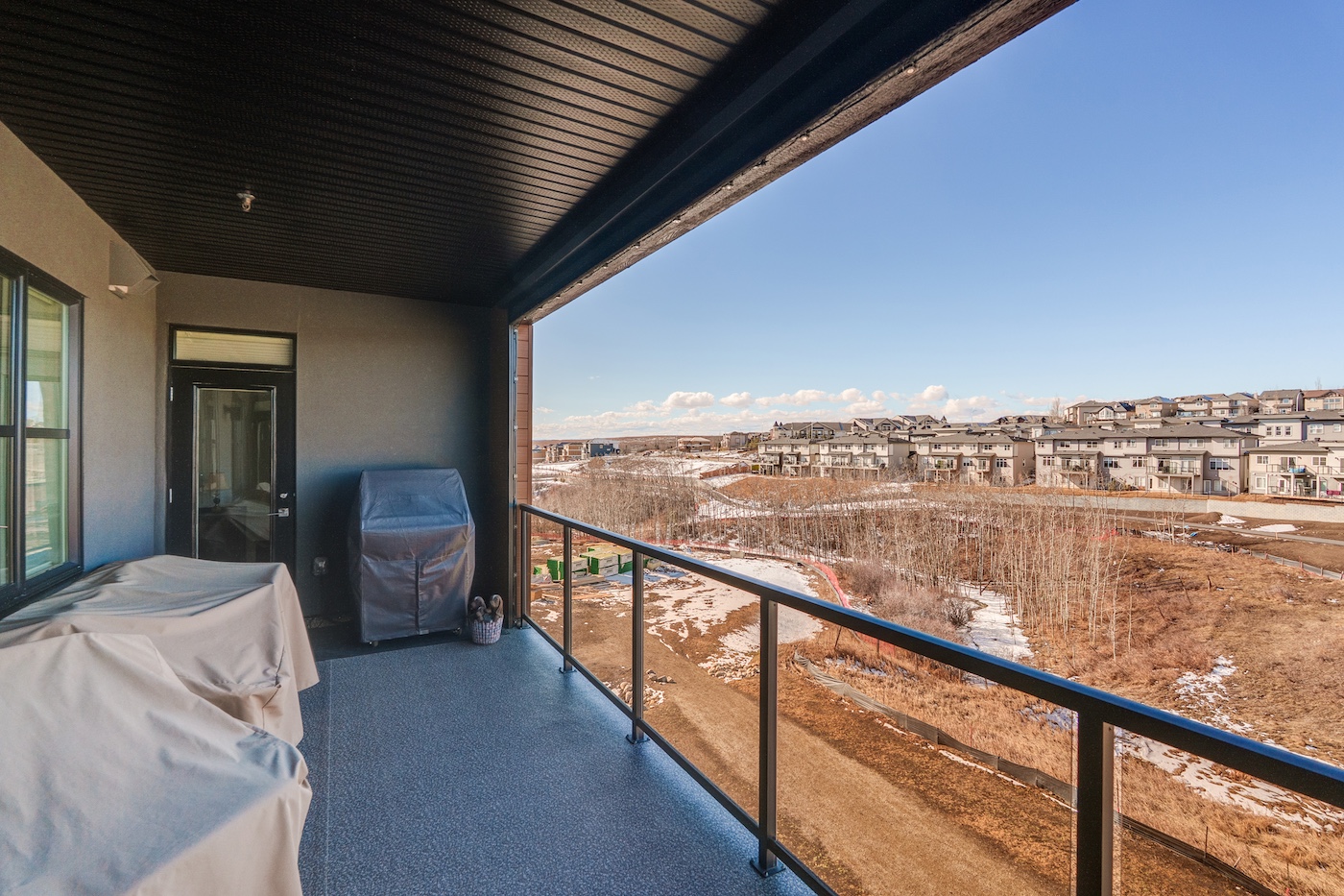 A balcony overlooking an outdoor view