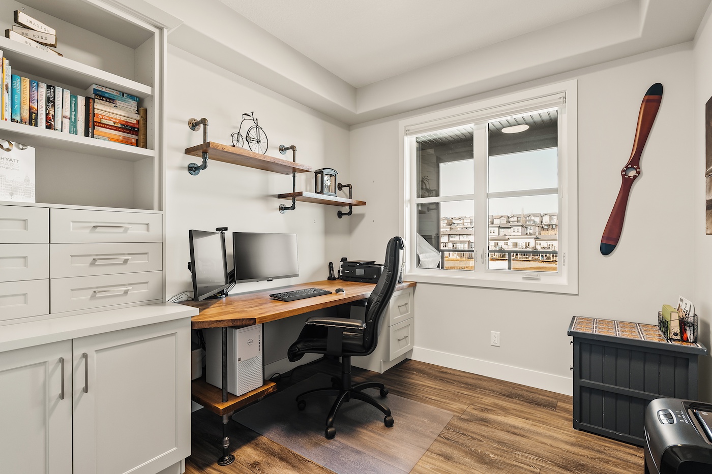 A home office with a window looking outside