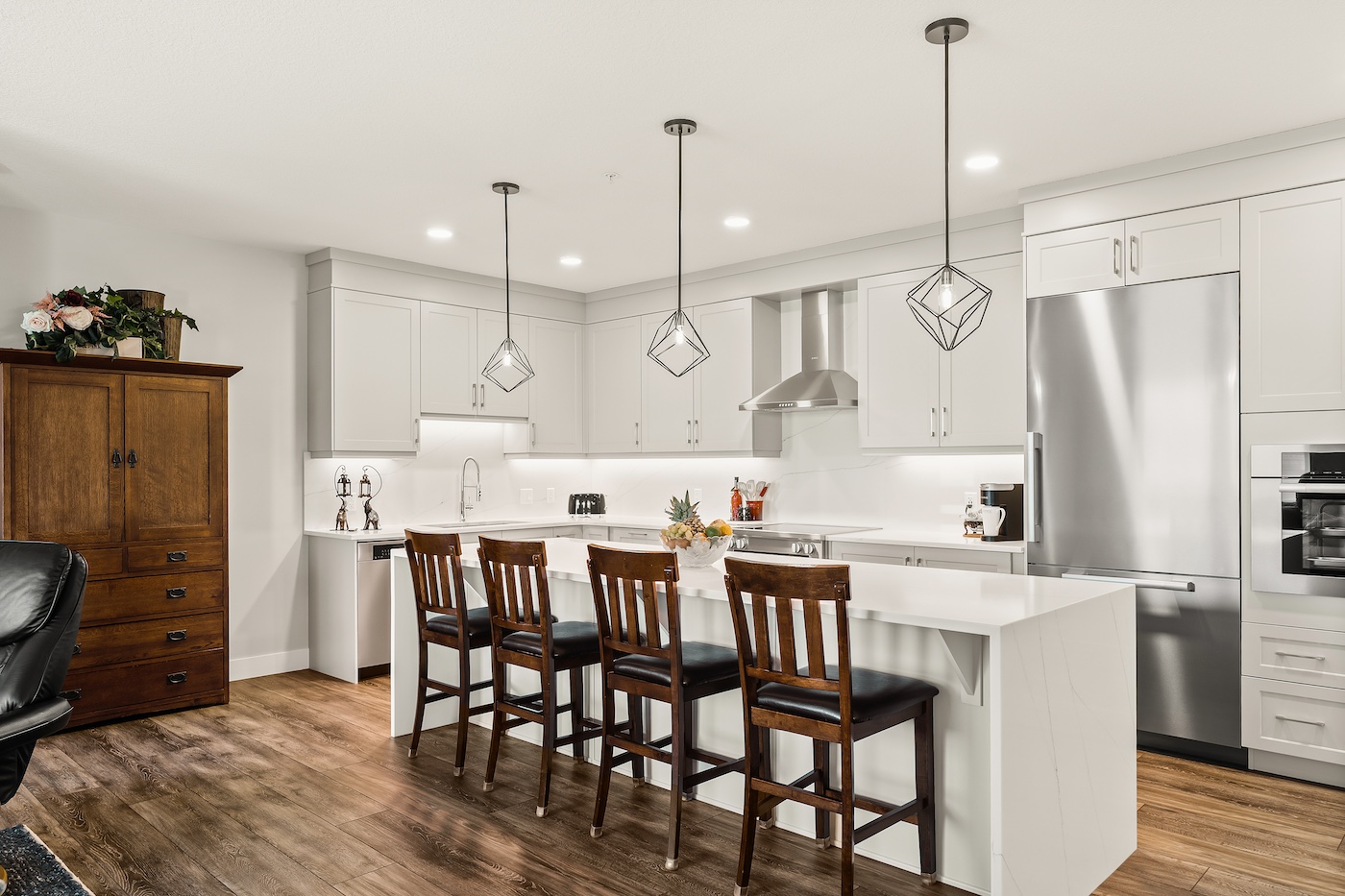 A kitchen with an island and seating