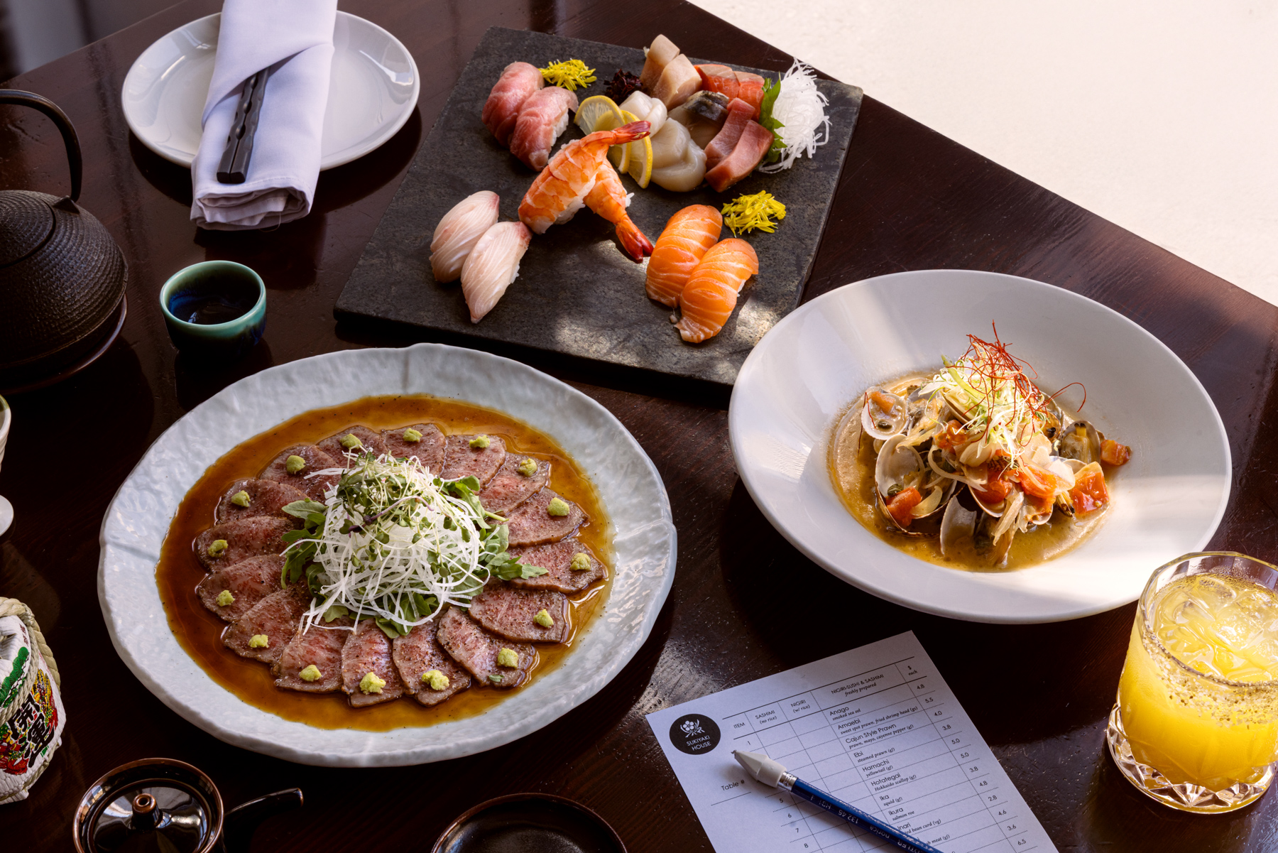 A spread of Japanese food on a dining table.