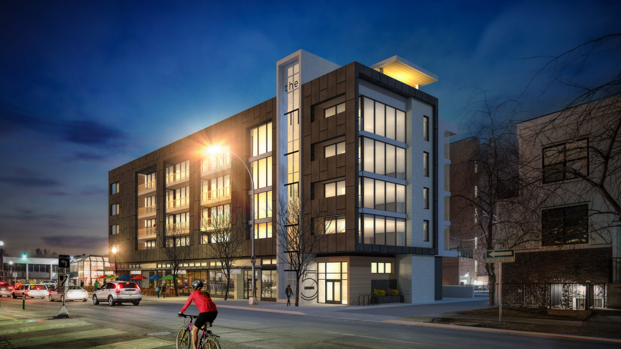 A photo rendering of a mixed-use development at night.