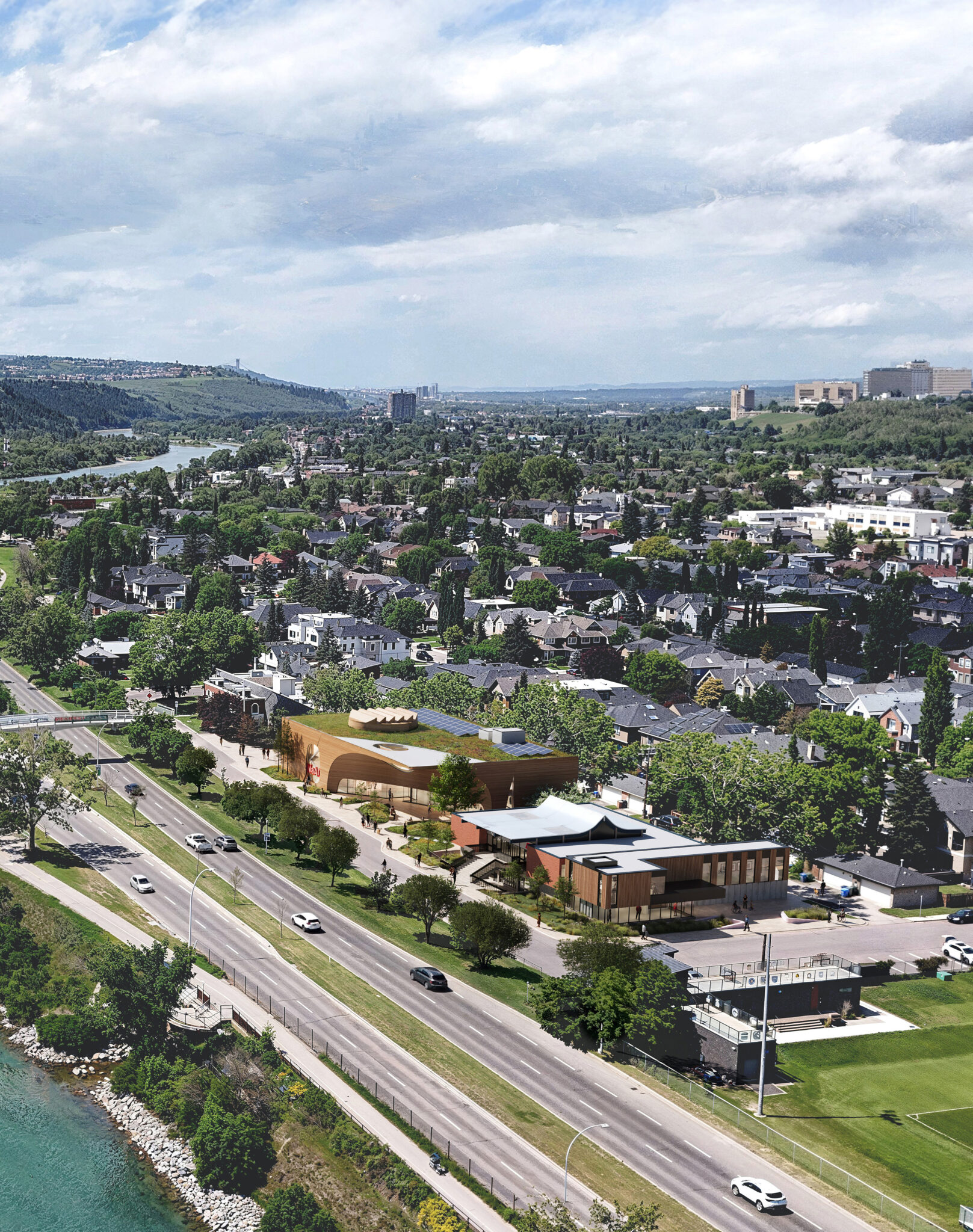 A bird's-eye view of a large arts centre beside roads and buildings.