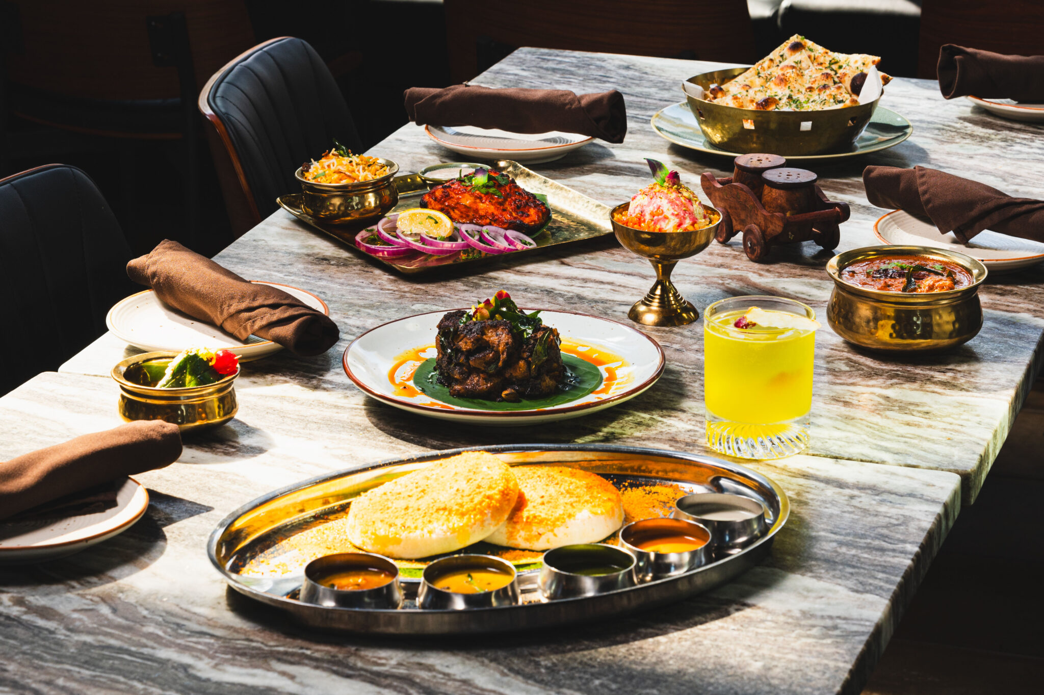 A selection of restaurant dishes and drinks on a table