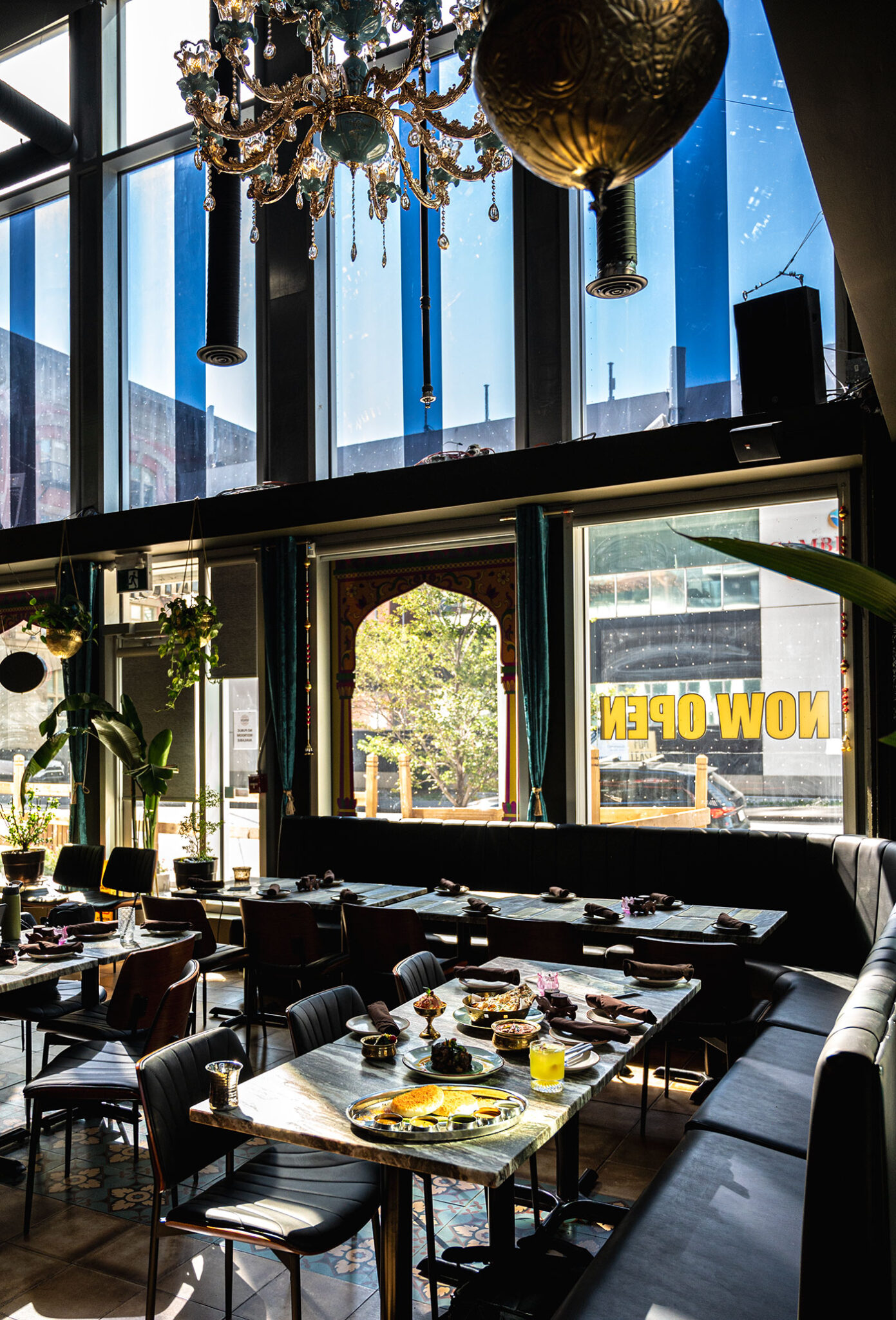 The sun shines on the interior of a restaurant.