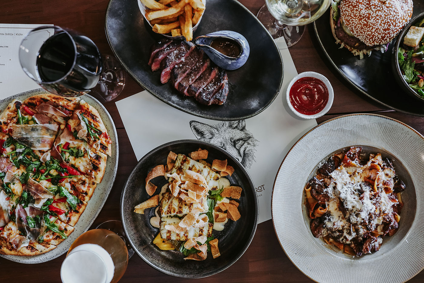 A variety of dishes sit on a table.