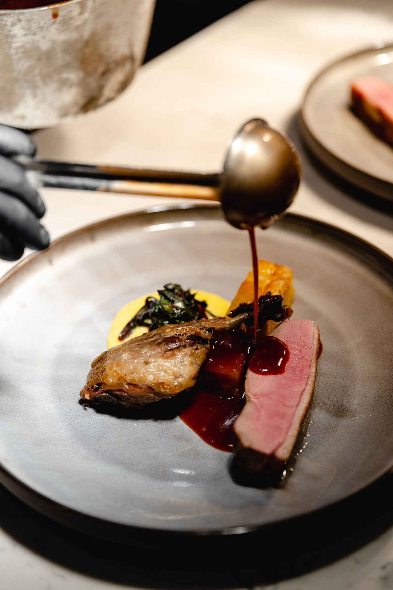 The confit duck dish at the David Thompson Chef’s Table Culinary Experience.