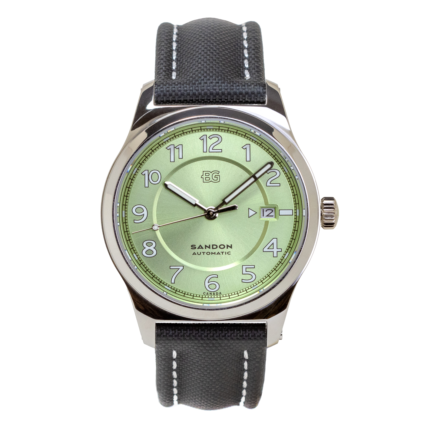 A watch with a pistachio green face