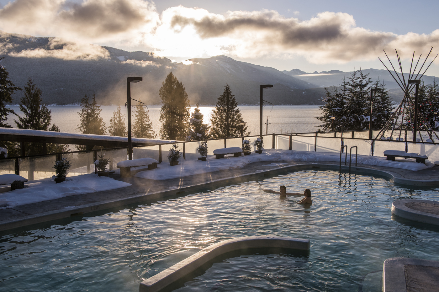 Two people in a hot springs pool