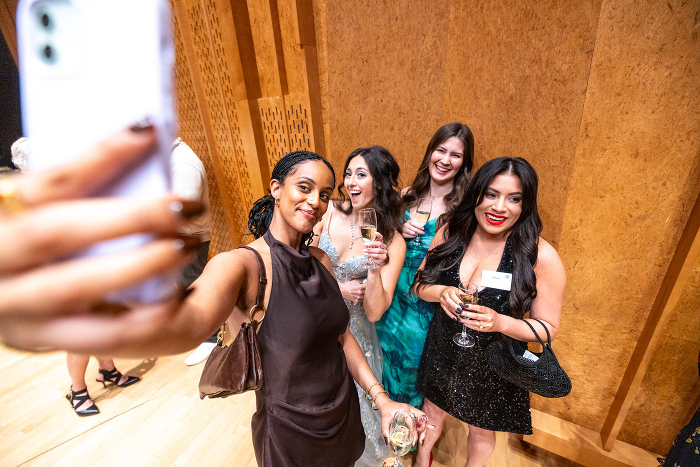 Four people pose for a selfie