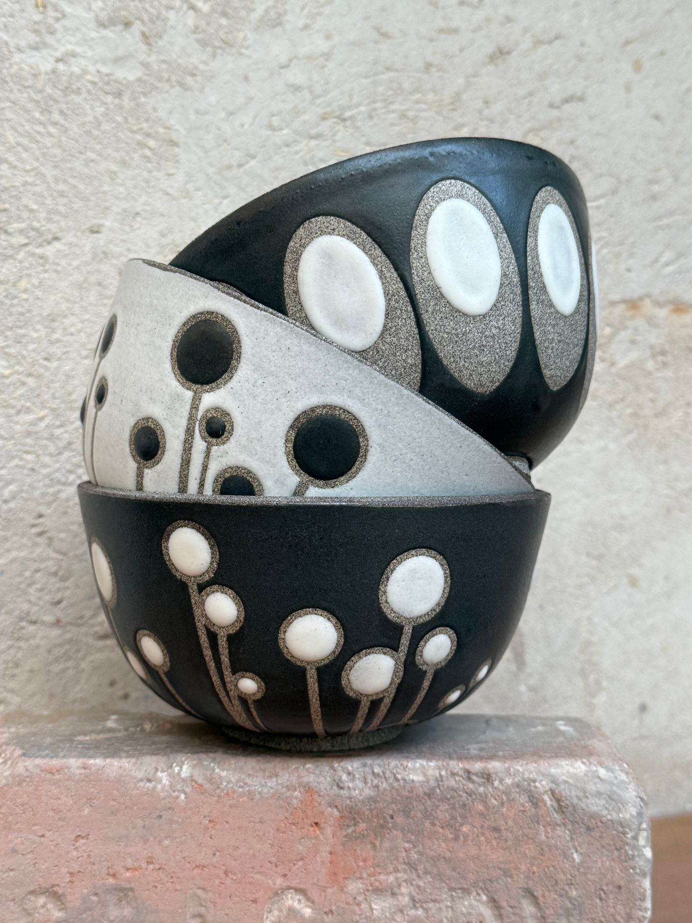 Three pottery bowls stacked on top of each other