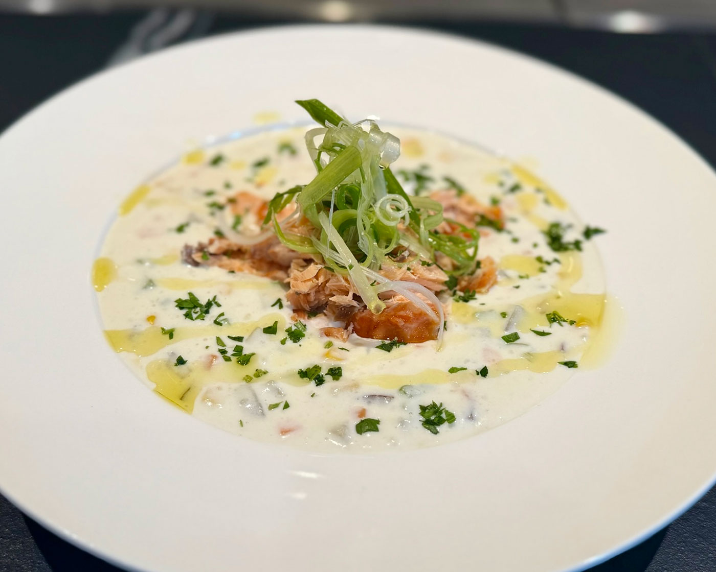 A bowl of salmon clam chowder