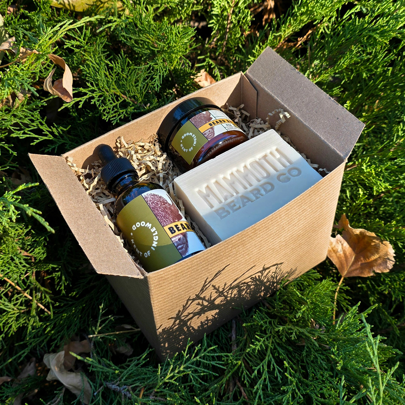 A box of beard products sitting on the grass