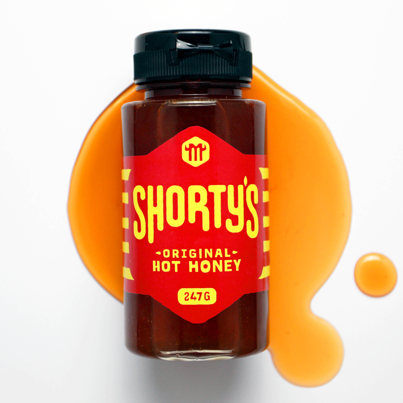 A bottle of hot honey with a red label