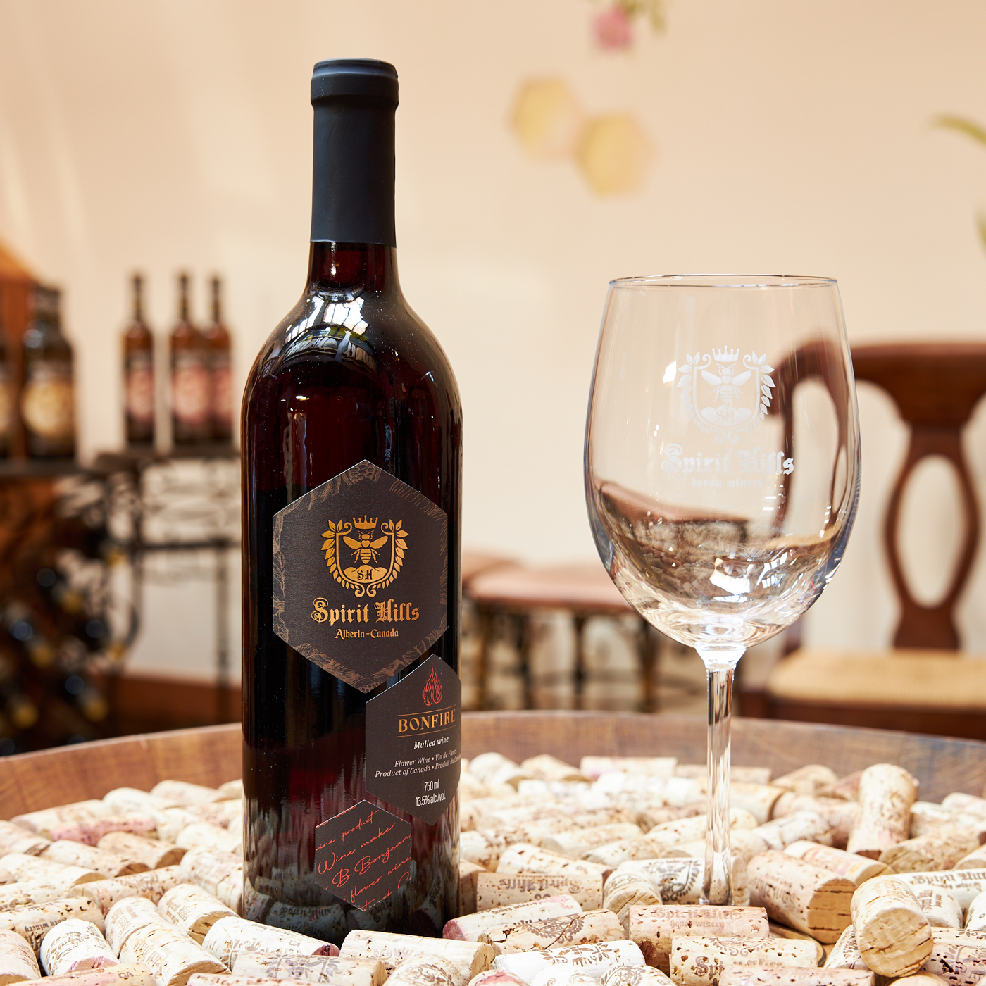 A bottle of wine beside a wine glass