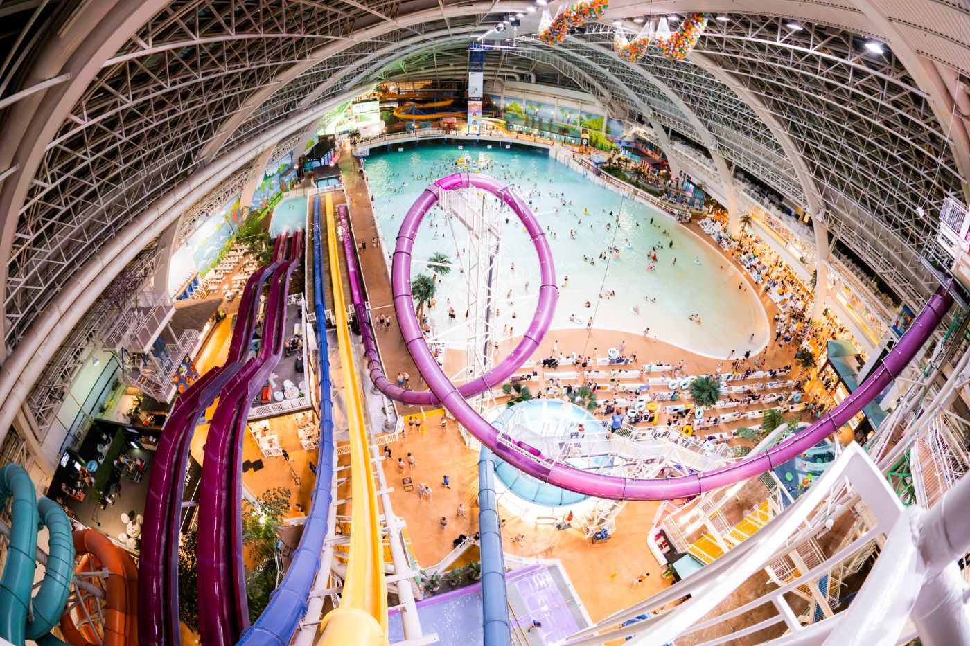 A waterpark with slides, swimming areas and seating