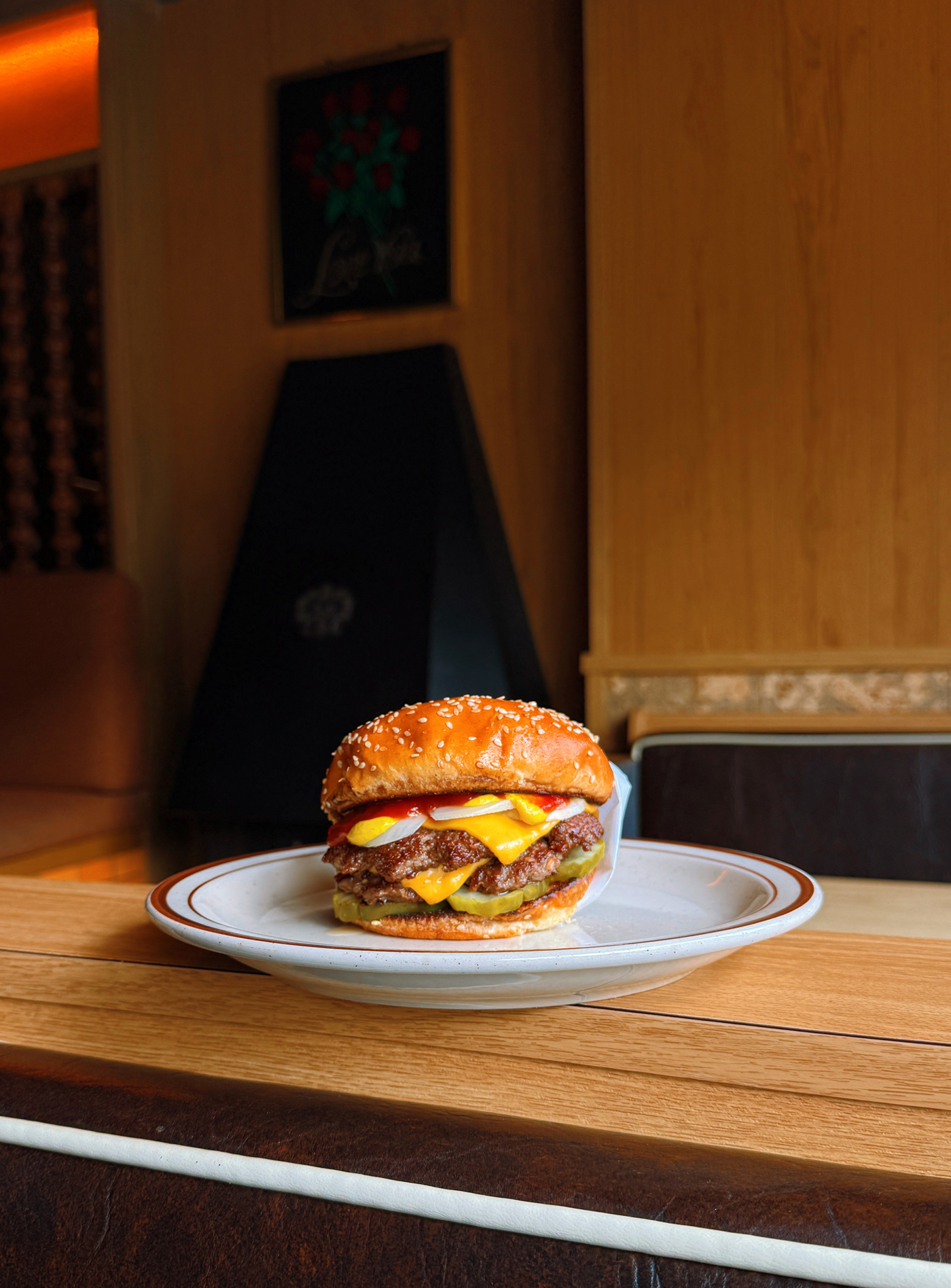 A burger sits on a plate