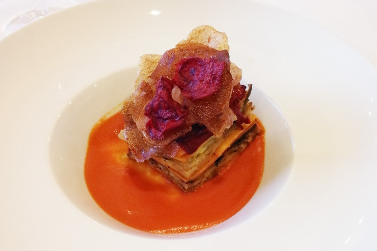 The pasta course was a vegan lasagna layered with zucchini, butternut squash, eggplant, red pepper and a cashew “cheese” sauce. The base is tomato jus, and spiced beet and potato chips top it off. 