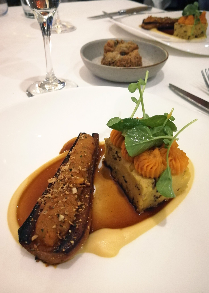 Playing off the concept of bone marrow, the main course was a hollowed-out parsnip filled with butternut squash and served with a chickpea panisse. One the side is a mushroom falafel ball on a bed of pureed roasted pumpkin, parsley and herbs.