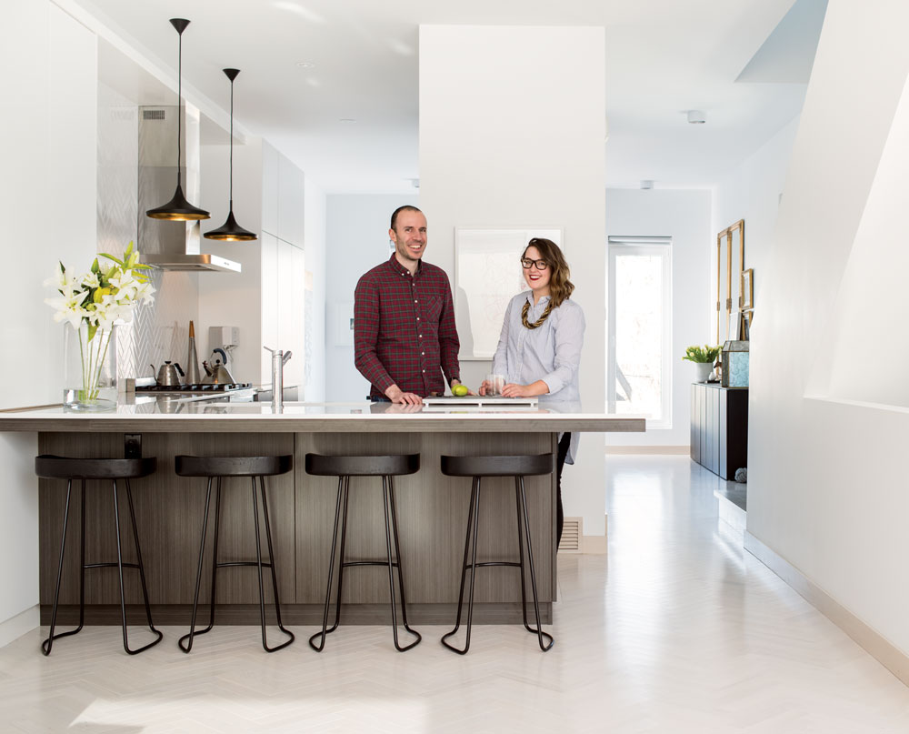 Homeowners Anna and Paul Niemczewski in the kitchen of their Housebrand-built inner-city home.Counter stools from Restoration Hardware. 