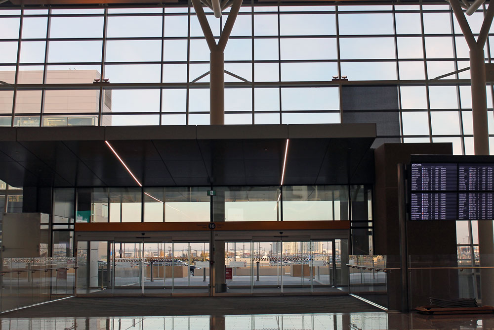 The first thing you'll probably notice when you enter the new International Terminal is how much natural light there is. Turns out, this was a design choice made for sustainability. The design maximizes the capture of natural light, which reduces the need for artificial light — so it also reduces how much energy the building uses. The International Terminal also collects rainwater and snowmelt, water that is then filtered, stored and used for flushing toilets. Geothermal radiant floor heating and cooling is used too — there are 660 kilometres of in-floor radiant heating tubing and 581 geothermal wells. This is the first airport in Canada that has a geothermal system for heating and cooling. And those are just a few of the sustainable features that make this building green. According to Marco Mejia, the Vice-President of Planning and Engineering at The Calgary Airport Authority, the design choices will result in 27 per cent less power consumption and 52 per cent less water consumption.