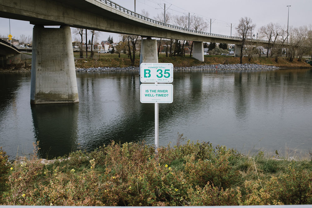 Subtext: River Signs, 2014, Vinyl on aluminium. 100 signs, each 30 x 51 cm. Elbow River pathways, from the confluence upstream to Sandy Beach, and Bow River pathways on the north and south banks from the downtown core upstream to Crowchild Trail.