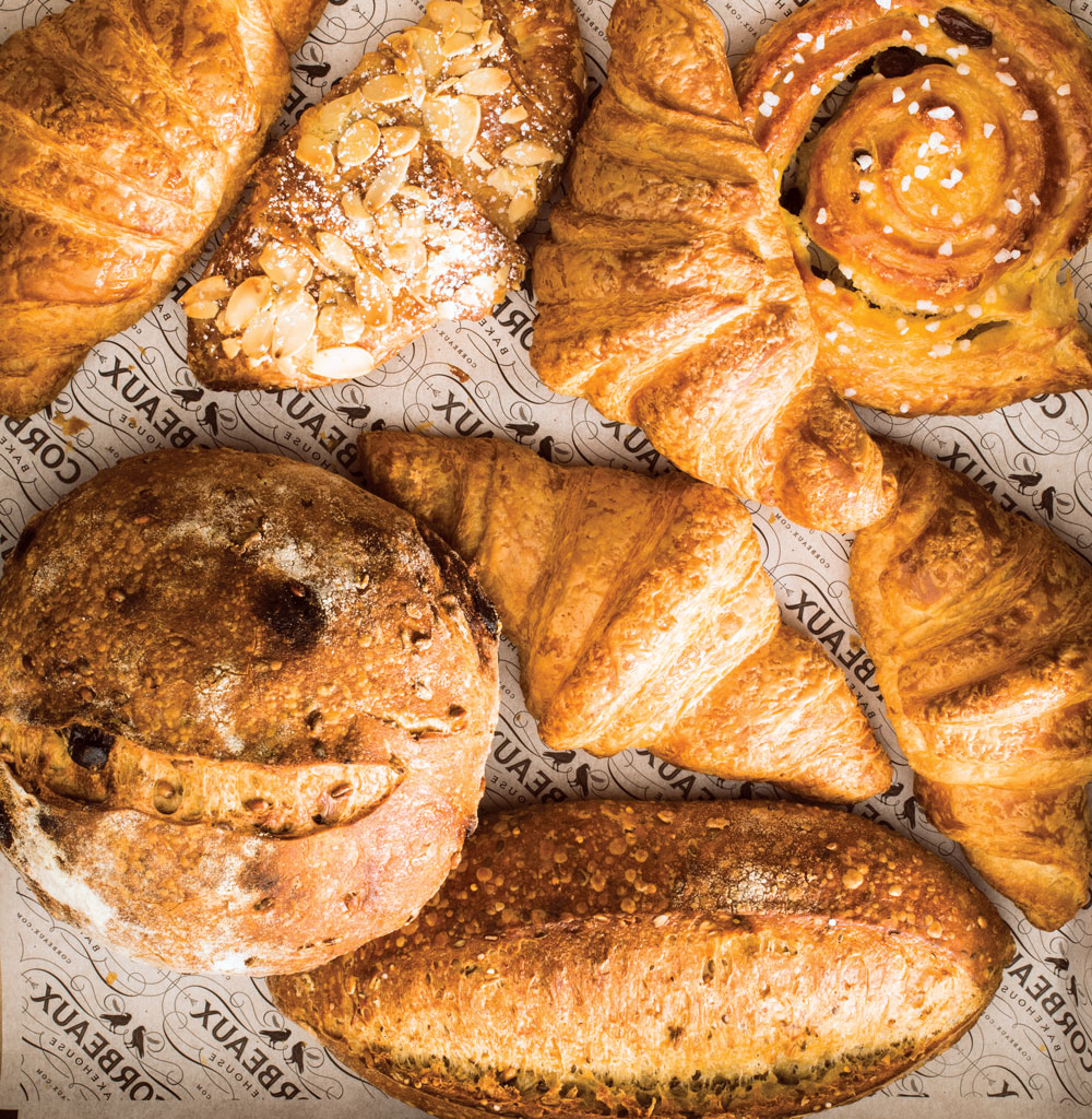 Grainful bread, sprouted grains bread, raisin croissants, almond croissants and raisin snail pastry, made by Corbeaux Bakehouse for Analog Cafe.