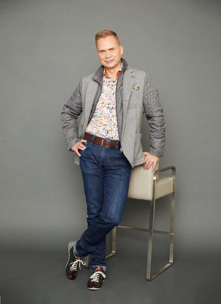 Jacket by Roberto P Luxury, butterfly shirt by 7 Downie St., both from Supreme Men’s Wear; jeans by AG, belt from Hudson’s Bay; shoes by Cruyff; pocket square by Roberto P Luxury; 007 Stool supplied by Limitless. 