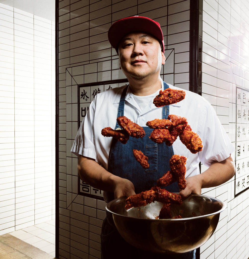 Chef Roy Oh preparing his signature gochujang chicken wings.