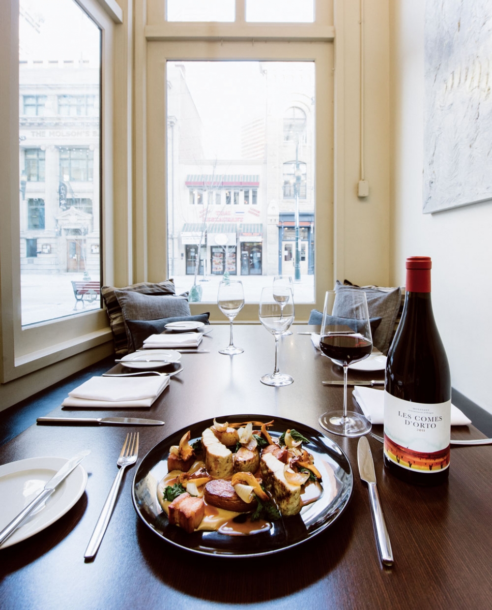 Grilled loin of B.C. sturgeon, confit fingerling potatoes, roasted chanterelle purée, double smoked bacon, cippolini onion leaves and sauce au poivre.