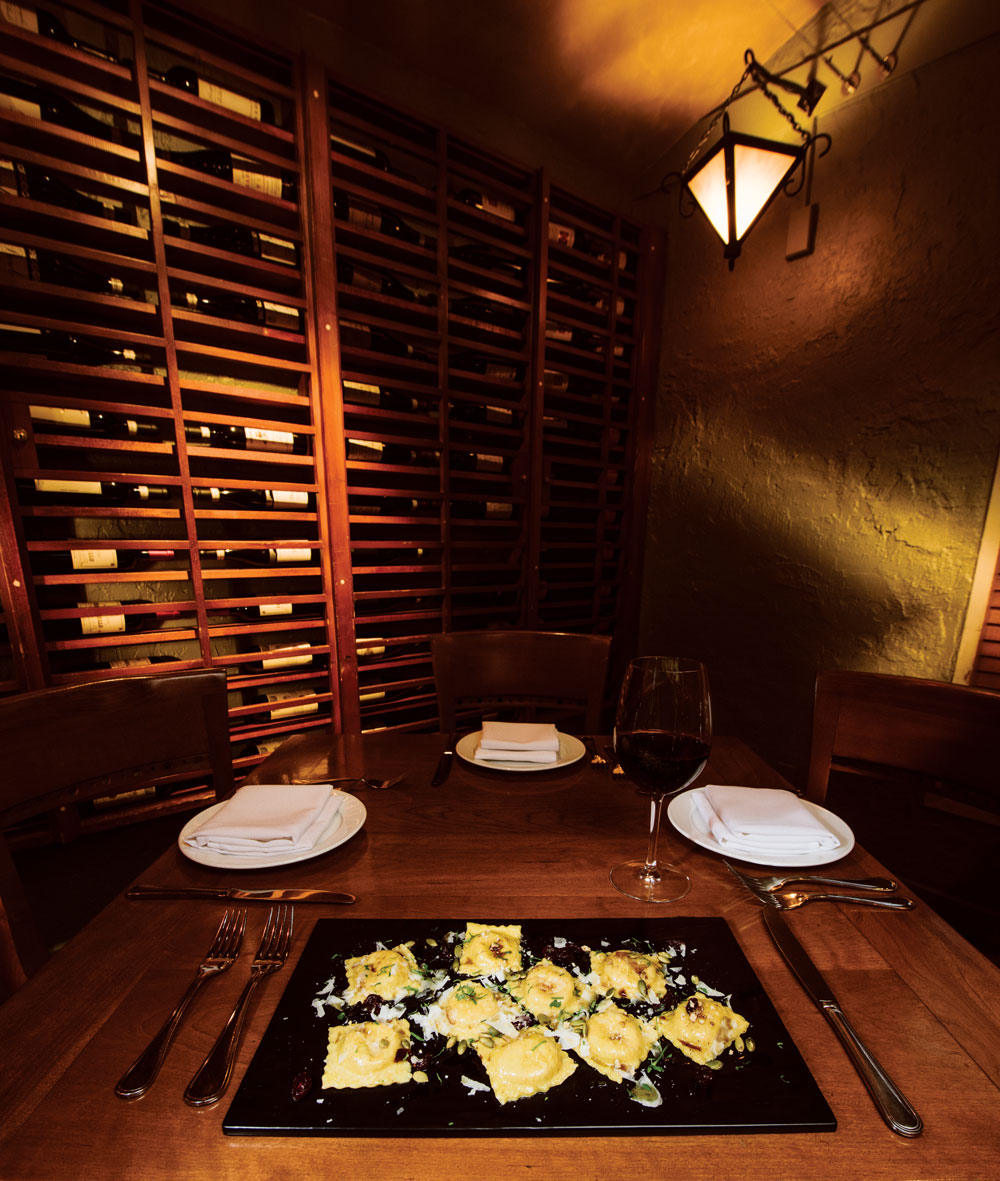 Pumpkin ravioli with brown butter, cranberries and pumpkin seeds.