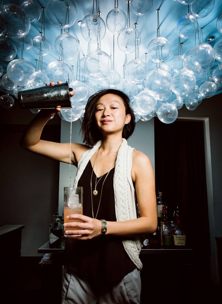 General manager and mixologist Christina Mah pouring a signature cocktail.