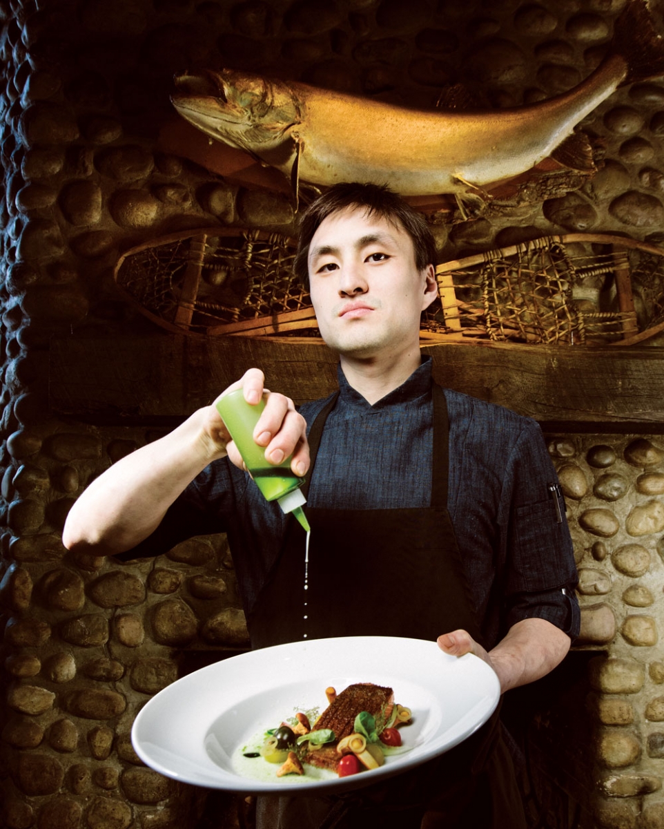 Chef de cuisine Matthias Fong plating his crisp-skinned pan-seared trout.