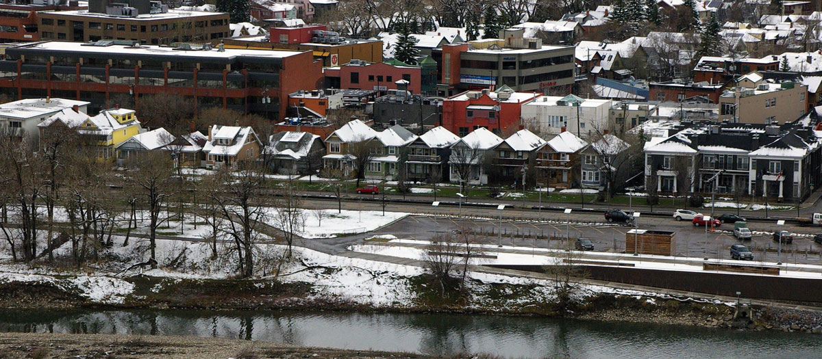 Thirteen contiguous houses along Memorial Drive N.W., shown from across the Bow River, were demolished in 2017. Photographed in May 2014.