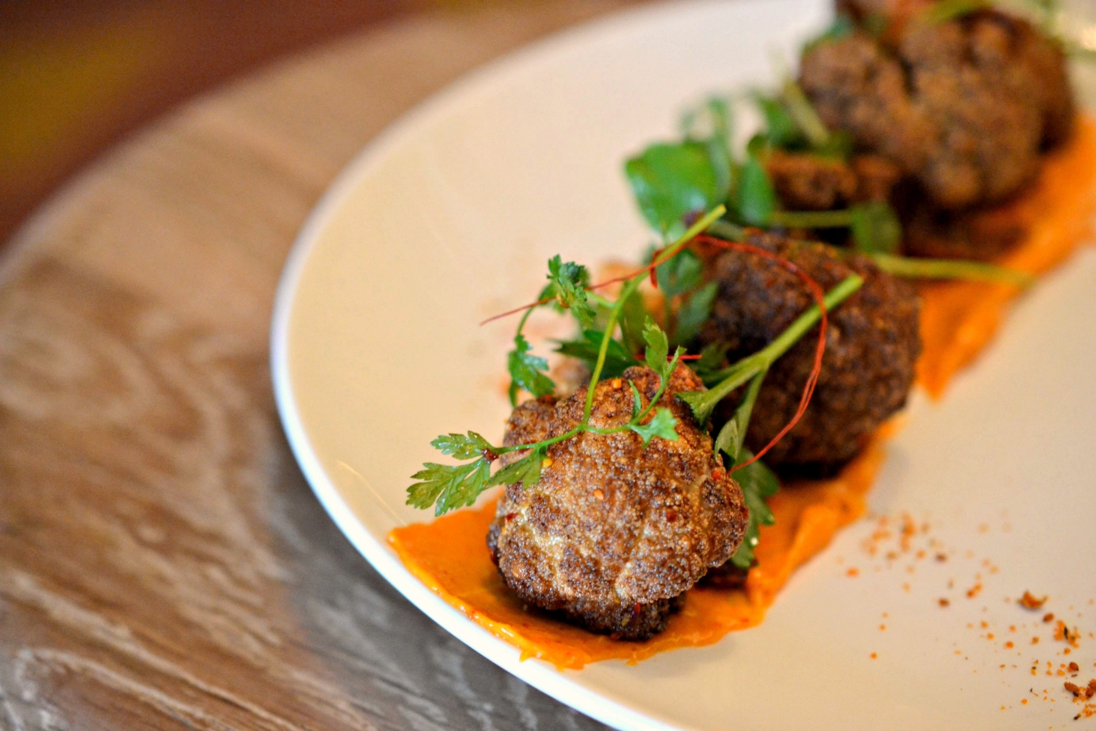 Fried cauliflower with harissa garlic sauce.