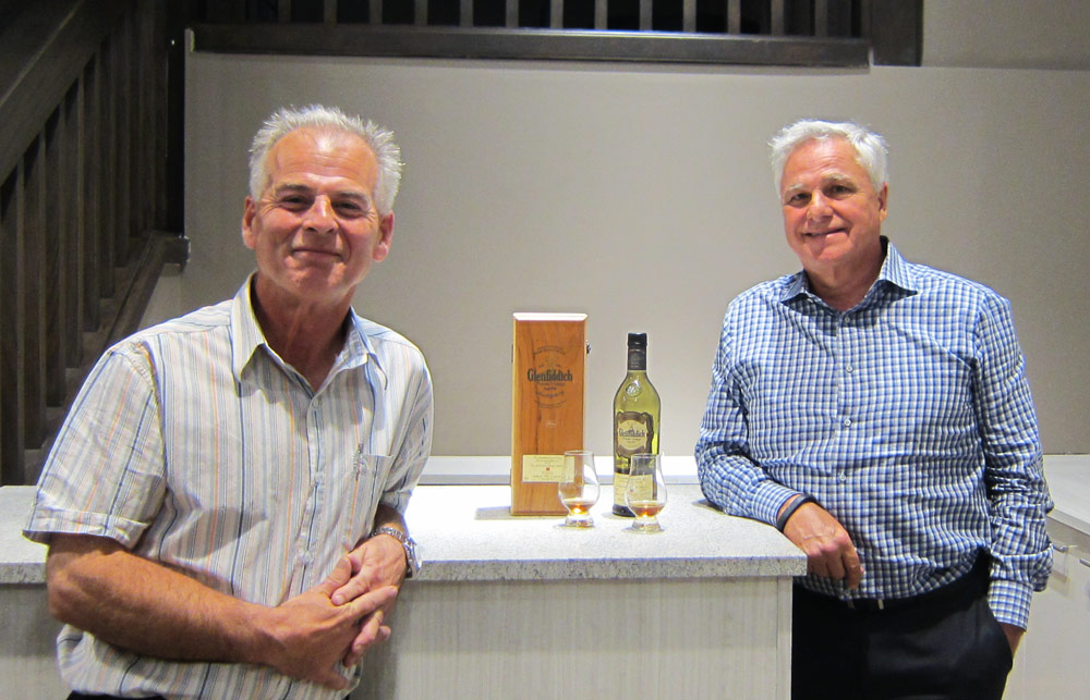 Willow Park Wine & Spirits scotch expert David Michiels and owner Wayne Henuset taste a 1975 Glenfiddich at the new mixology centre and tasting bar.