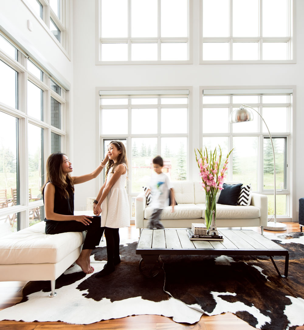 Large windows provide stunning views of the sprawling Alberta Foothills.