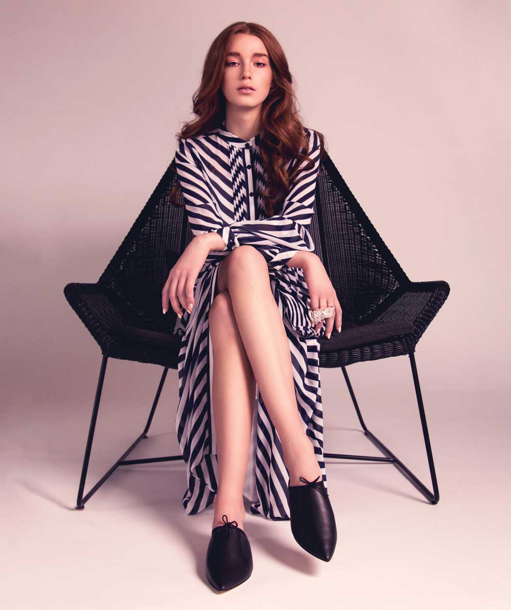 Bias-stripe midi dress, 50, by Michael Michael Kors; double-quartz cluster ring, 30, by Kate Hewko; Repetto Fayza shoes, 15, from gravitypope; Breeze highback outdoor chair, ,820, from Maria Tomás.