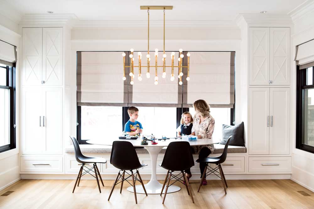 The dining nook balances style and function with a window seat designed for durability and a configuration of Knoll Saarinen table and Knoll Eames chairs.